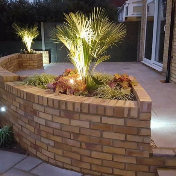 Curved wall with flower bed